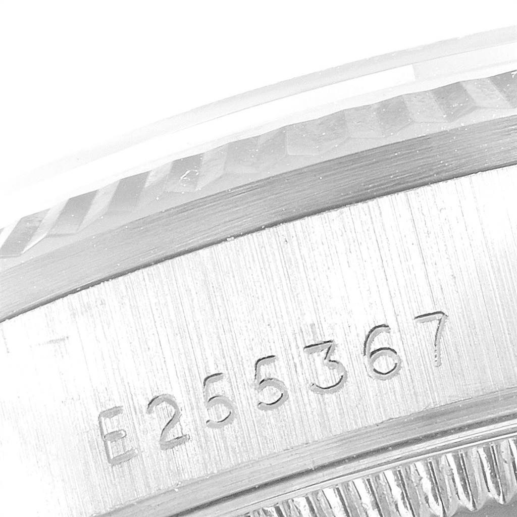 This image shows a close-up of the serial number engraving on the side of a Rolex President 68279 Women's White Gold White Dial 68279 Women's White Gold White Dial model watch case.