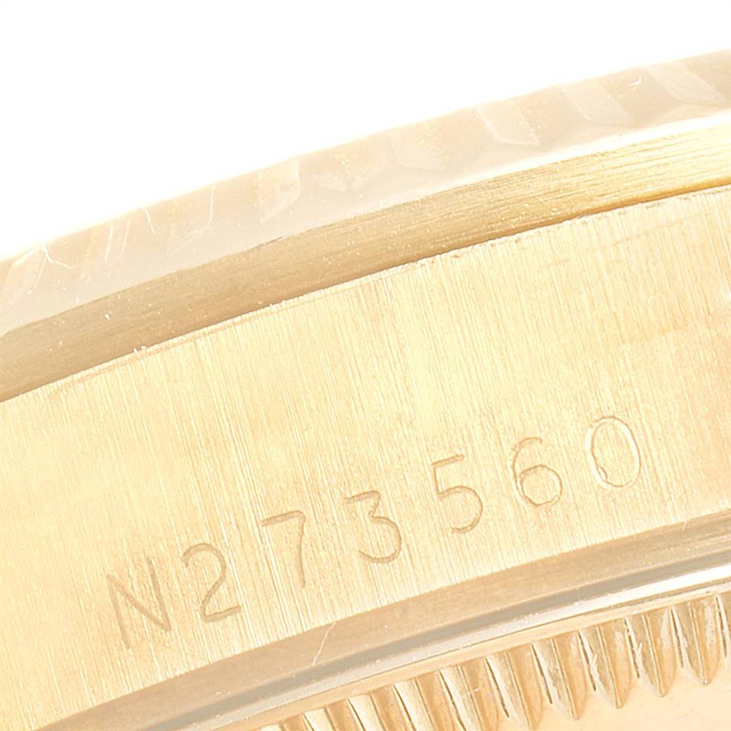 This image shows a close-up of the serial number engraving on the side of the Rolex President 68278 Women
s Yellow Gold Champagne Dial 68278 Women
s Yellow Gold Champagne Dial watch.