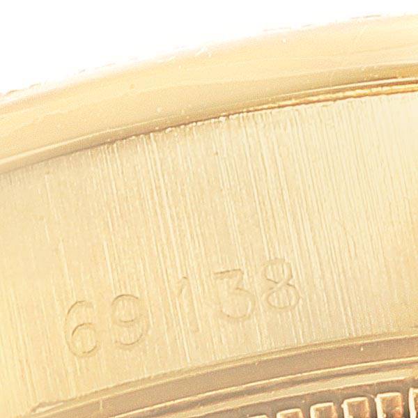 This close-up image shows the model number engraved on the side of a Rolex President 69138 Women's Yellow Gold Blue Dial 69138 Women's Yellow Gold Blue Dial watch.
