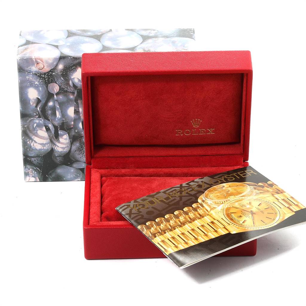 The image shows a red Rolex watch box for the President model, an outer box cover, and a brochure with a picture of the watch.