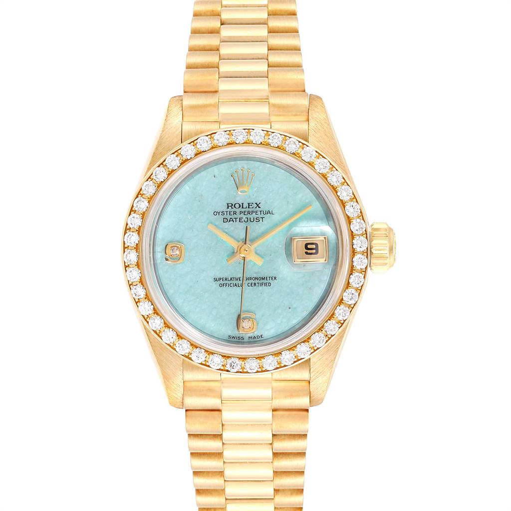 This image shows a front view of the Rolex President 69138 Women's Yellow Gold Blue Dial 69138 Women's Yellow Gold Blue Dial model watch, featuring a gold bracelet, turquoise dial, and diamond bezel.