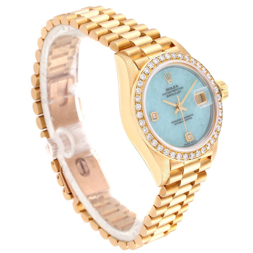 The image shows a Rolex President 69138 Women's Yellow Gold Blue Dial 69138 Women's Yellow Gold Blue Dial model watch at a three-quarter angle highlighting the face, bezel, and bracelet.