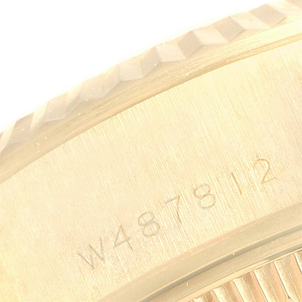 The image shows a close-up view of the serial number and bezel of a Rolex President 69178 Women
s Yellow Gold Champagne Dial 69178 Women
s Yellow Gold Champagne Dial model watch.