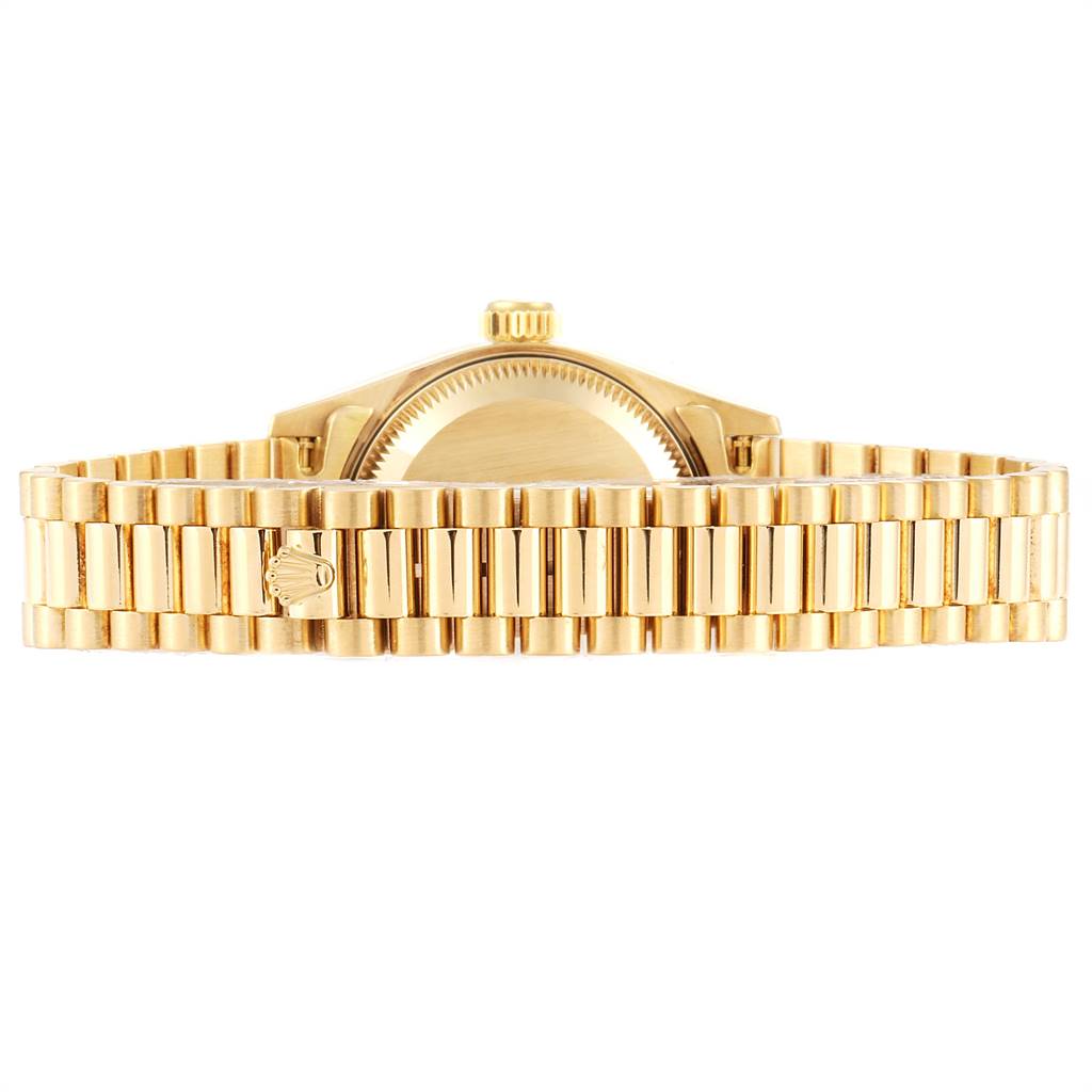 This image shows the back of the case and band of a Rolex President 69178 Women
s Yellow Gold Champagne Dial 69178 Women
s Yellow Gold Champagne Dial model watch.