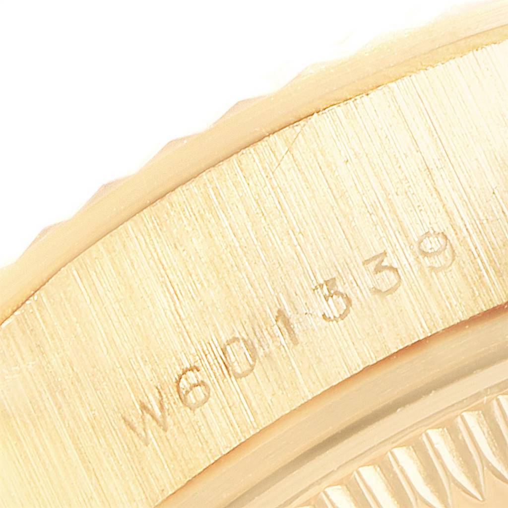 This close-up image shows the serial number engraved on the side of a Rolex President 69178 Women
s Yellow Gold Champagne Dial 69178 Women
s Yellow Gold Champagne Dial model watch.