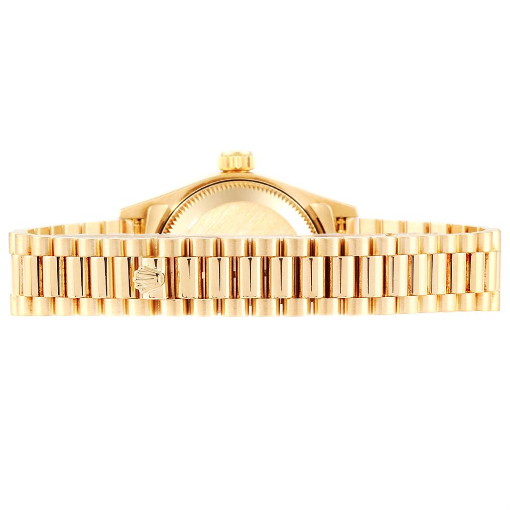 This image shows a rear view of the Rolex President 69178 Women
s Yellow Gold Champagne Dial 69178 Women
s Yellow Gold Champagne Dial model watch, showcasing its case back and gold bracelet.