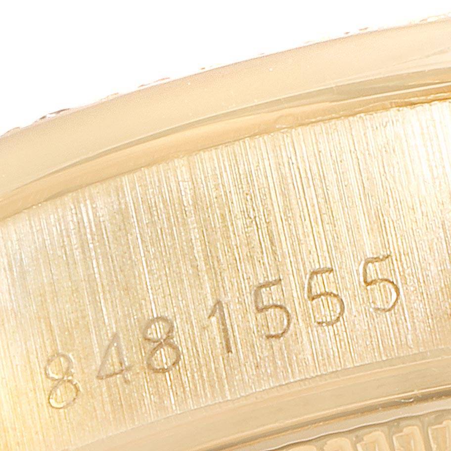 This close-up image shows the serial number engraving on the side of the Rolex President 69138 Women
s Yellow Gold Champagne Dial 69138 Women
s Yellow Gold Champagne Dial model watch.