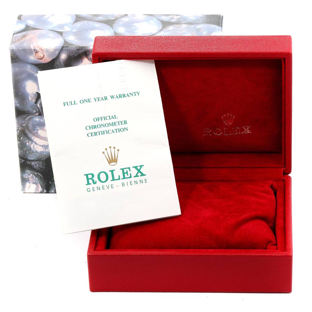 A Rolex President 69138 Women
s Yellow Gold Champagne Dial 69138 Women
s Yellow Gold Champagne Dial model watch box with official chronometer certification and warranty card angled slightly from the front.