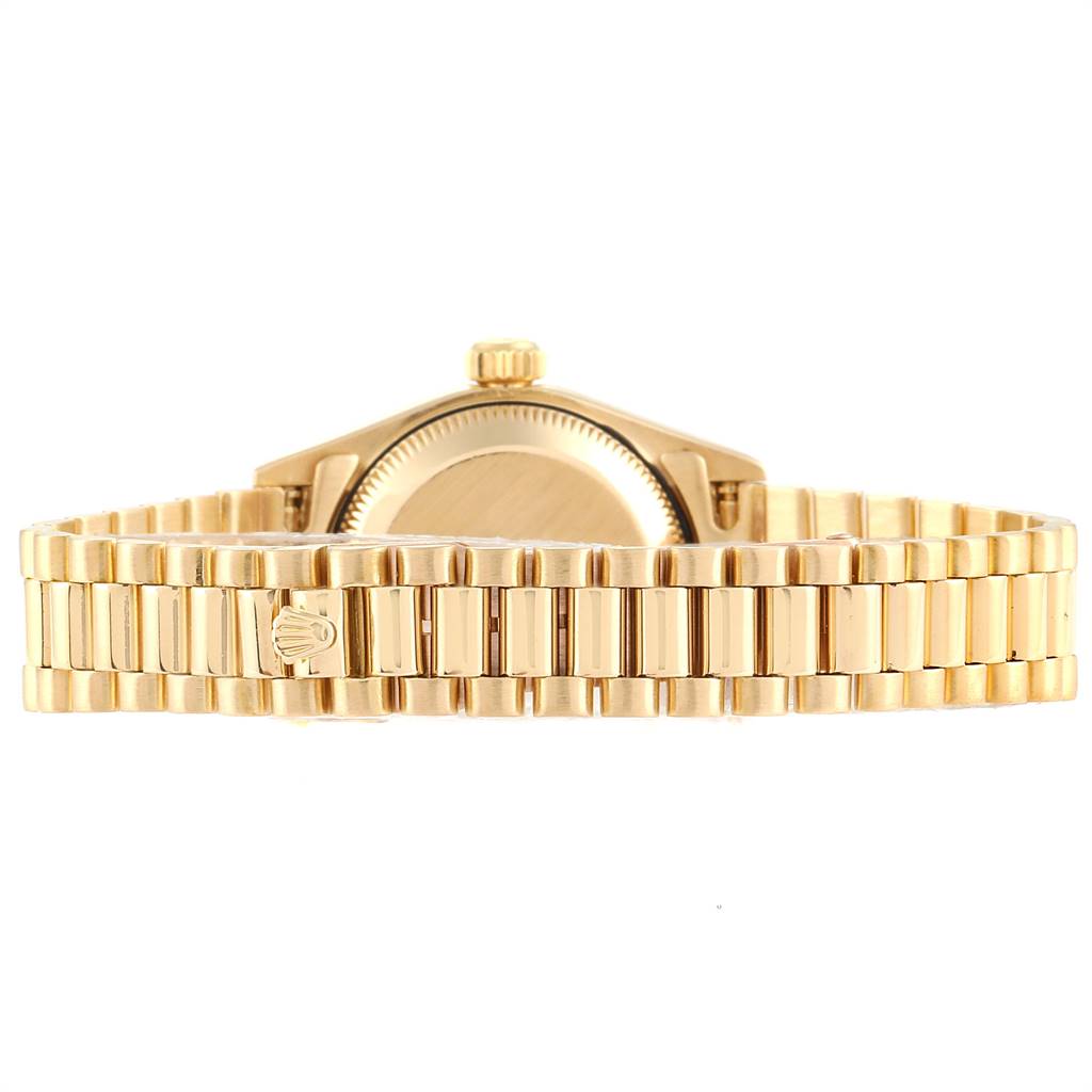 The image shows the back view of a Rolex President 69138 Women
s Yellow Gold Champagne Dial 69138 Women
s Yellow Gold Champagne Dial watch, highlighting the bracelet and case back.