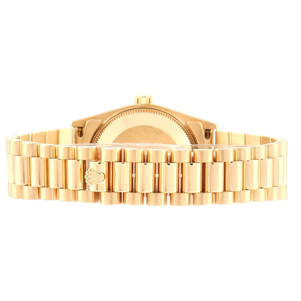 This image shows the back and bracelet of a Rolex President 68278 Women
s Yellow Gold Champagne Dial 68278 Women
s Yellow Gold Champagne Dial model watch from a top-angle view.