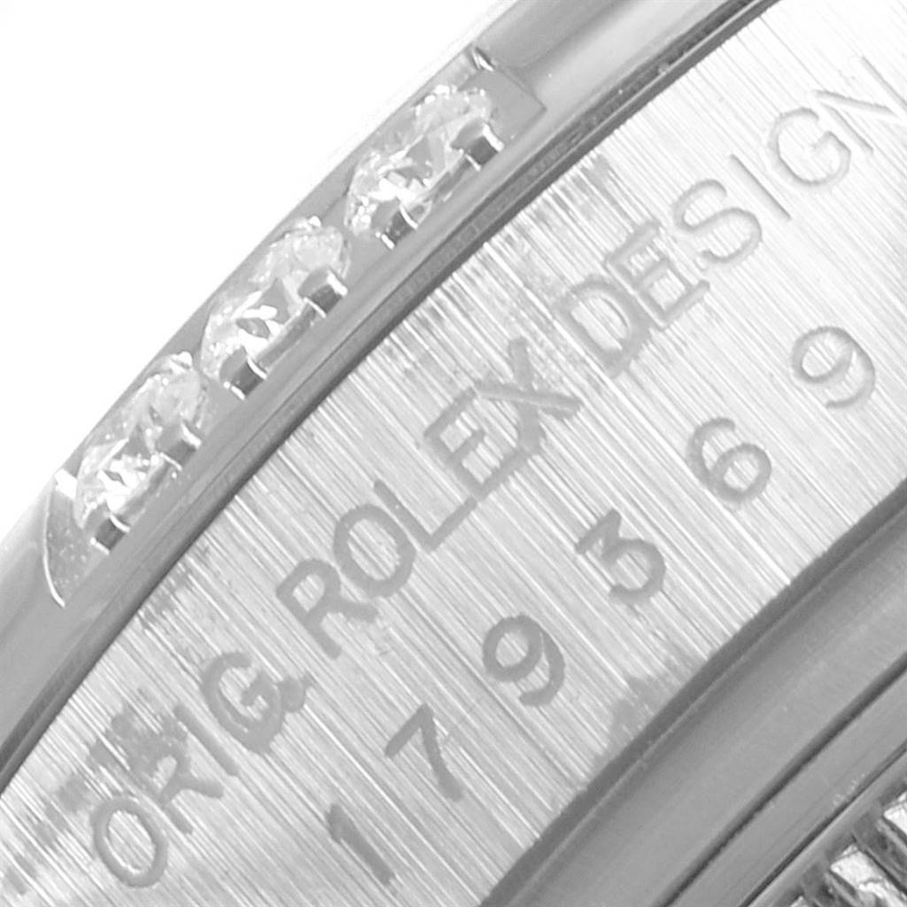 This close-up shows the side engraving and diamond setting of the Rolex President 179369 Women's White Gold Blue Dial 179369 Women's White Gold Blue Dial watch model.