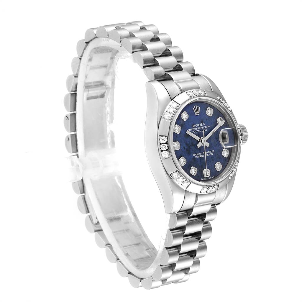 This image shows a side angle of a Rolex President 179369 Women's White Gold Blue Dial 179369 Women's White Gold Blue Dial model watch, featuring its band, case, and dial with diamond accents.