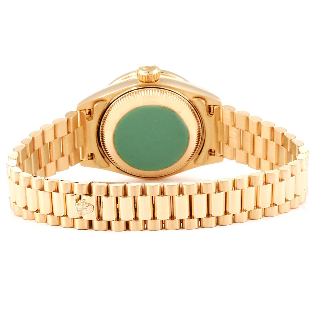 This image shows the back of the Rolex President 69138 Women
s Yellow Gold Champagne Dial 69138 Women
s Yellow Gold Champagne Dial model, including the watch case and its gold bracelet.