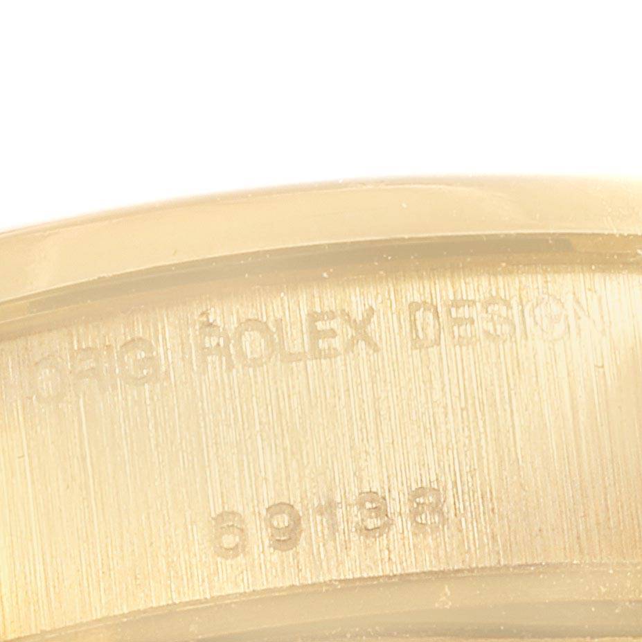 This image shows a close-up of the side engraving on a Rolex President 69138 Women
s Yellow Gold Champagne Dial 69138 Women
s Yellow Gold Champagne Dial model watch.