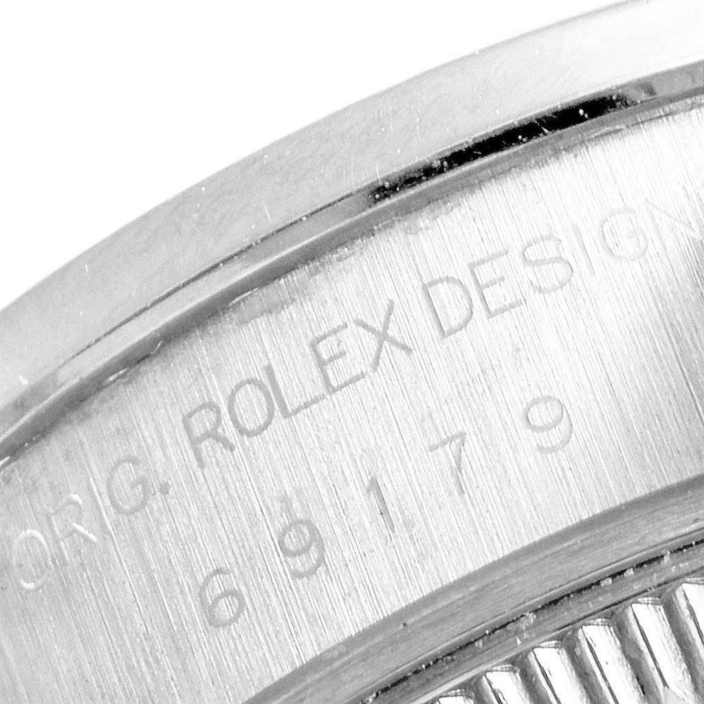 This image shows a close-up view of the case back with engraving on the Rolex President 69179 Women's White Gold Silver Dial 69179 Women's White Gold Silver Dial model watch.