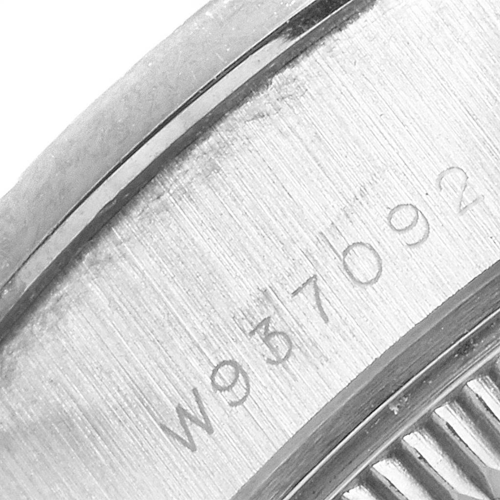 This image shows a close-up of the engraved serial number on the caseback of a Rolex President 69179 Women's White Gold Silver Dial 69179 Women's White Gold Silver Dial model watch.