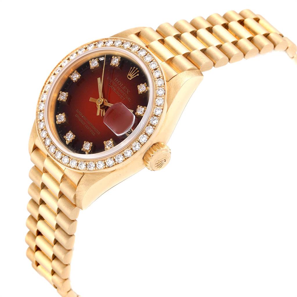 This image shows the side angle of a Rolex President 69138 Yellow Gold Red Dial 69138 Yellow Gold Red Dial model watch, highlighting its gold bracelet, diamond bezel, and red dial.