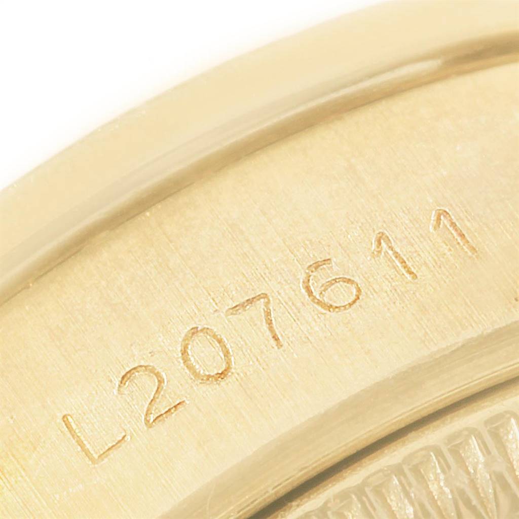 The close-up image shows a portion of the serial number on the President model by Rolex.