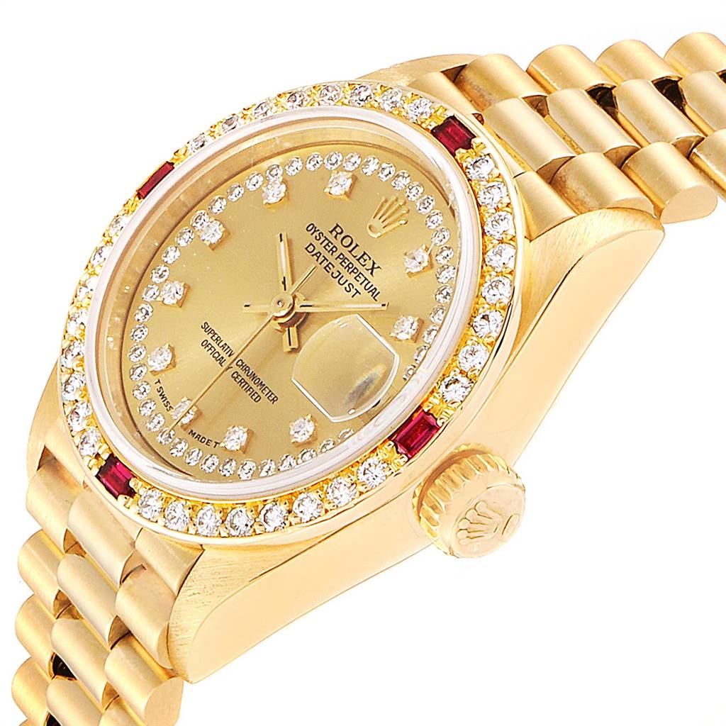 This image shows a close-up view of a gold Rolex President 69068 Women's Yellow Gold Champagne Dial 69068 Women's Yellow Gold Champagne Dial model watch, highlighting the bejeweled dial, crown, bezel, and bracelet.