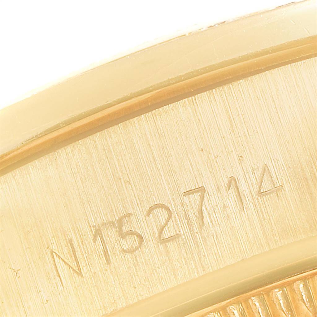 This image shows a close-up angle of the serial number engraved on the case of a Rolex President 69178 Women
s Yellow Gold Mother of Pearl Dial 69178 Women
s Yellow Gold Mother of Pearl Dial model watch.