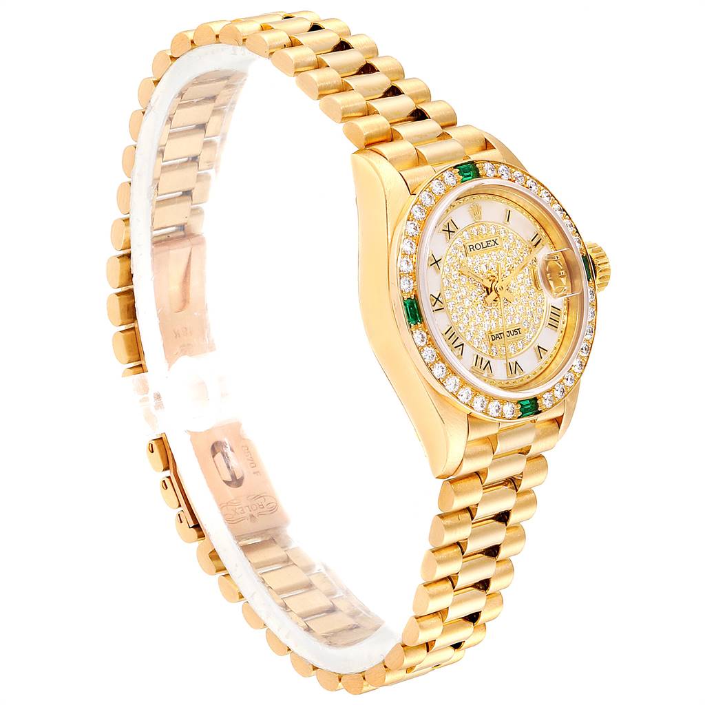 This image shows a side angle of a Rolex President 69178 Women
s Yellow Gold Mother of Pearl Dial 69178 Women
s Yellow Gold Mother of Pearl Dial model, highlighting its gold bracelet, diamond-set bezel, and dial.