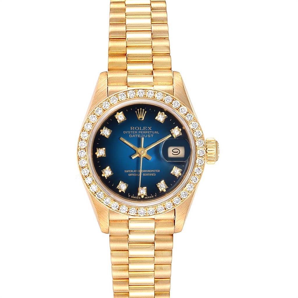 This image shows a Rolex President 69138 Women's Yellow Gold Blue Dial 69138 Women's Yellow Gold Blue Dial model watch, viewed from the front, featuring a gold and diamond-accented face and bracelet.