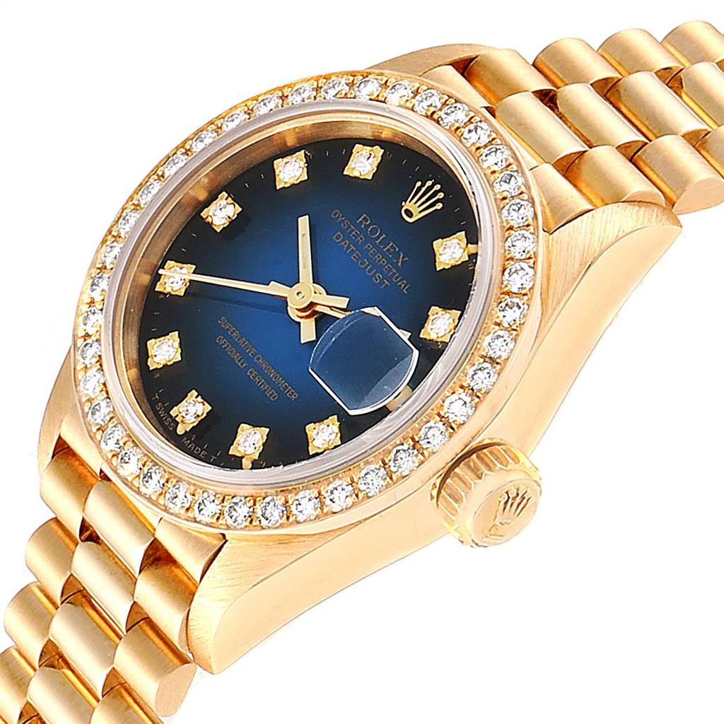 The image shows a Rolex President 69138 Women's Yellow Gold Blue Dial 69138 Women's Yellow Gold Blue Dial model from a slight angle, highlighting the face, bezel, crown, and part of the bracelet.