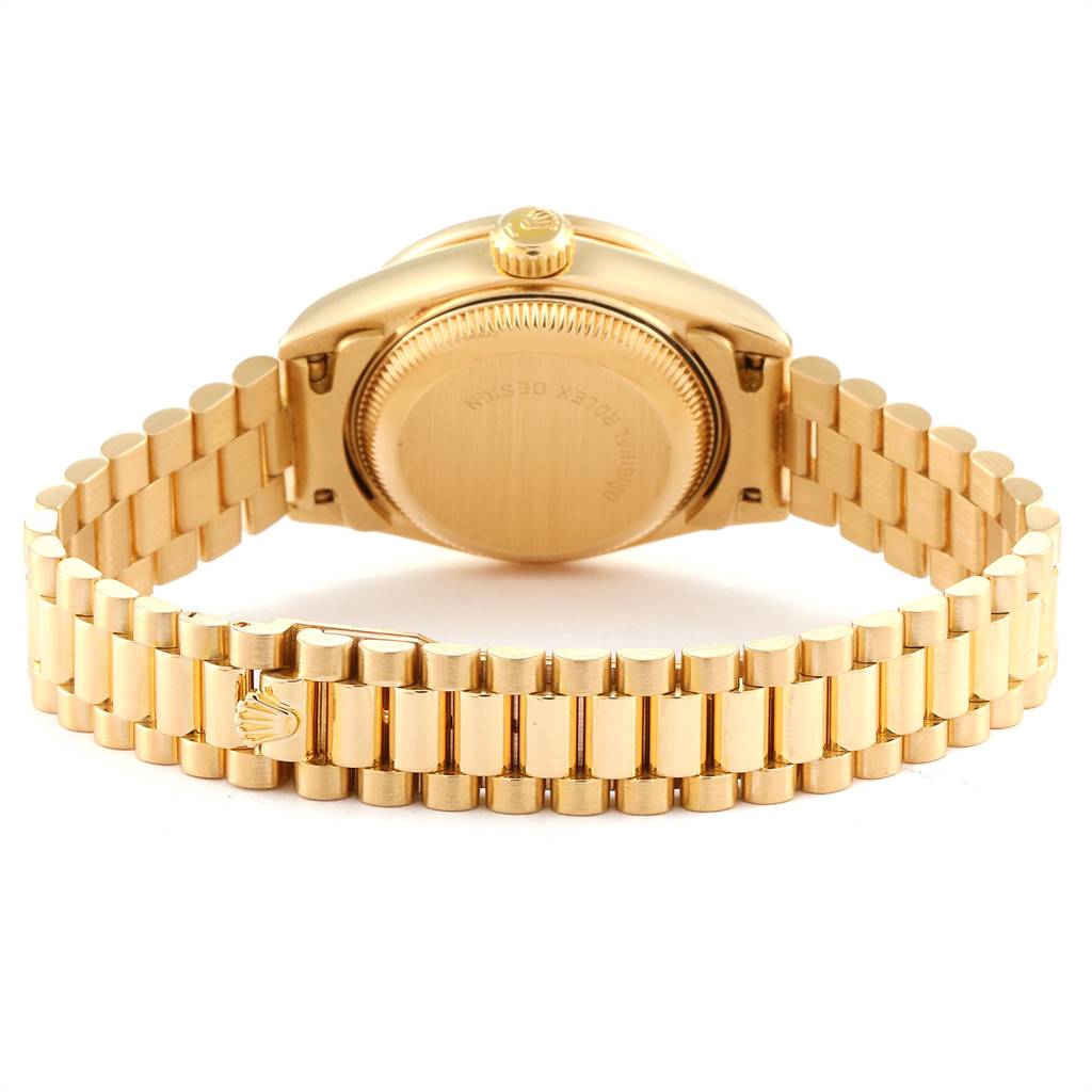 The image shows the back view of a Rolex President 69138 Women's Yellow Gold Blue Dial 69138 Women's Yellow Gold Blue Dial model watch, highlighting the case back and gold bracelet.