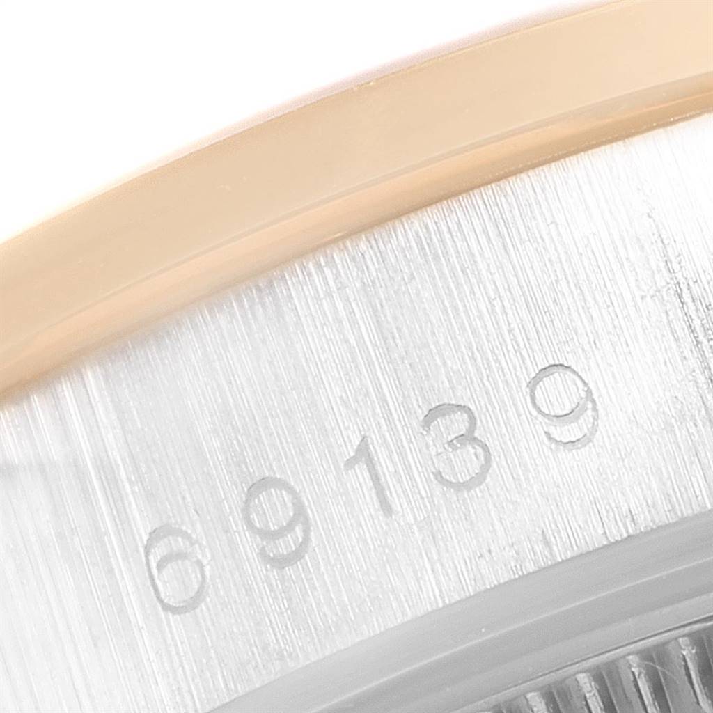 The image shows a close-up of the case side of a Rolex President 69179 Women's White Gold Brown Dial 69179 Women's White Gold Brown Dial watch with visible serial numbers.