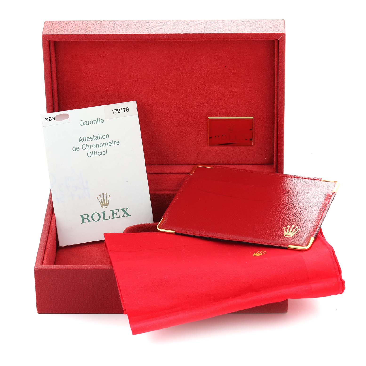 This image shows a Rolex President 179178 Women's Yellow Gold Mother of Pearl Dial 179178 Women's Yellow Gold Mother of Pearl Dial model watch box, warranty card, leather card holder, and polishing cloth.