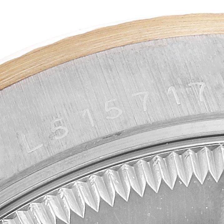 This is a close-up view of the bezel and serial number engraving on a Rolex President 68279 Women's White Gold Silver Dial 68279 Women's White Gold Silver Dial model watch.