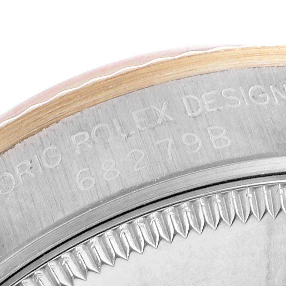 This close-up image focuses on the serial number engraving on the bezel and case of a Rolex President 68279 Women's White Gold Silver Dial 68279 Women's White Gold Silver Dial model watch.