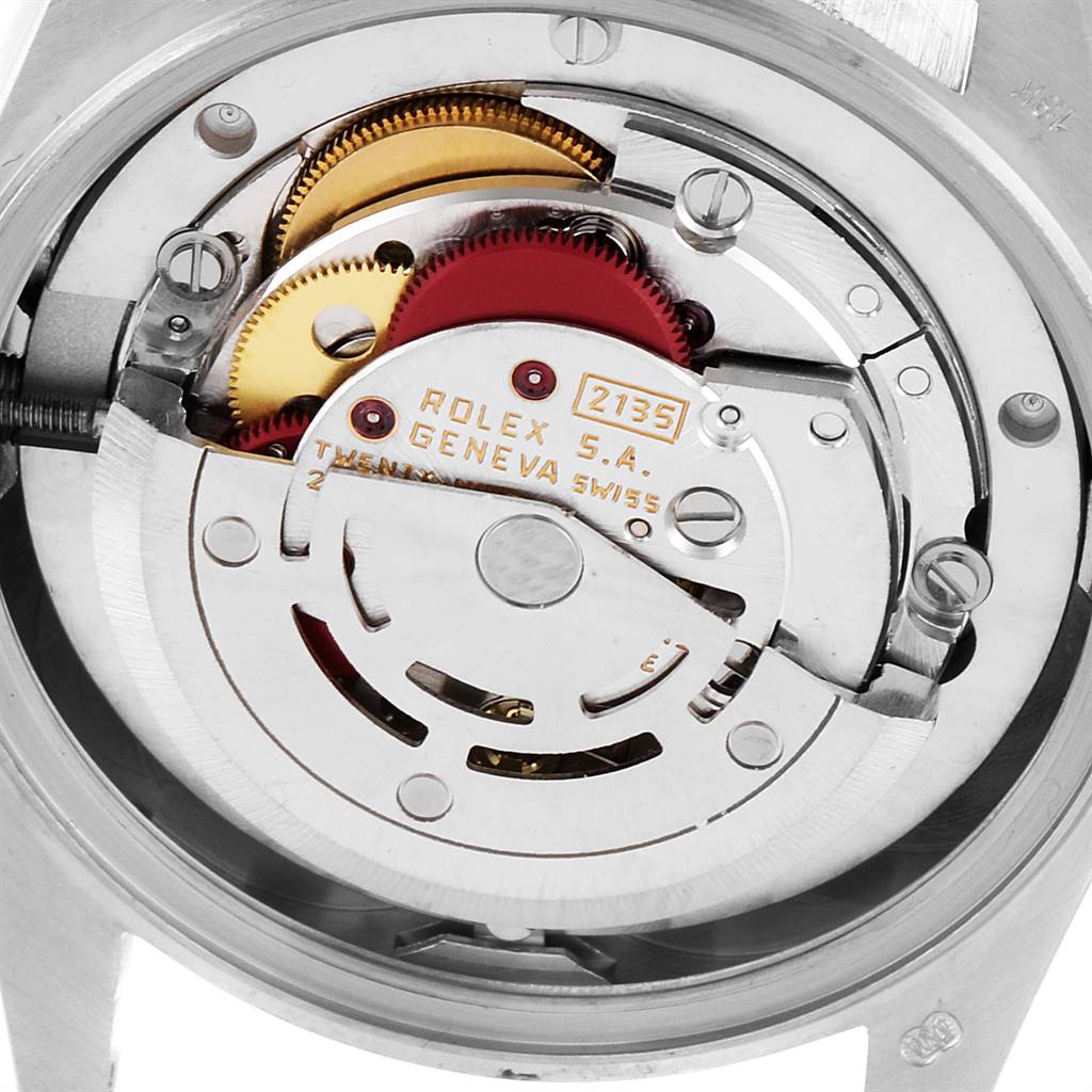The image shows the internal mechanism of a Rolex President 68279 Women's White Gold Silver Dial 68279 Women's White Gold Silver Dial model watch, highlighting gears and the movement assembly.