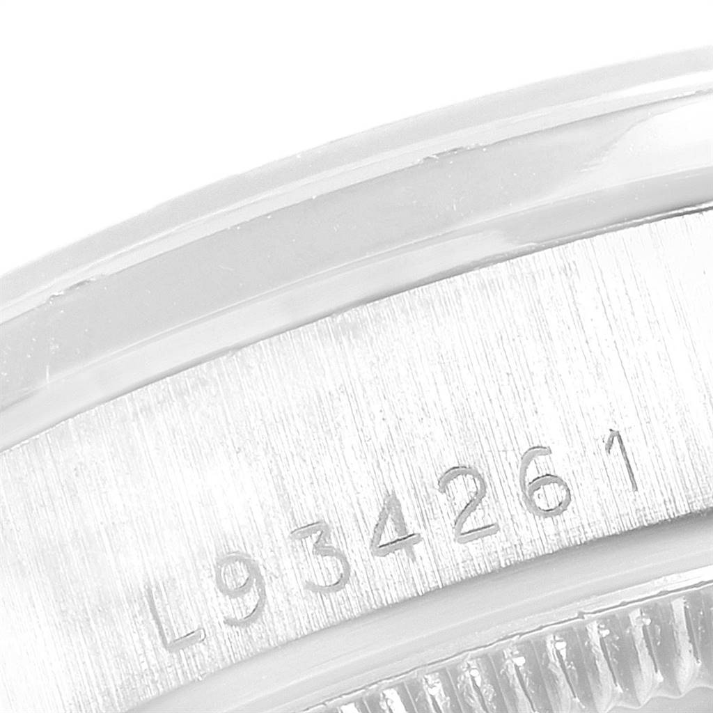 This is a close-up view of the serial number on the case of a Rolex President 68289 Women's White Gold Black Dial 68289 Women's White Gold Black Dial watch.