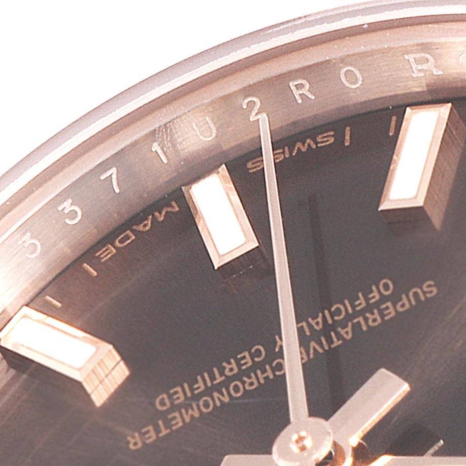 This close-up of a Rolex President 279165 Women
s Rose Gold Brown Dial 279165 Women
s Rose Gold Brown Dial watch shows the hour markers, part of the dial, and the second hand.