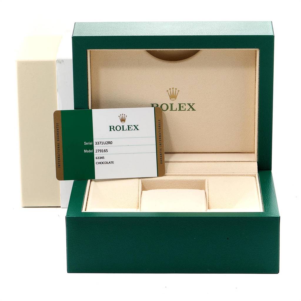 This image shows the open watch box and certification card for a Rolex President 279165 Women
s Rose Gold Brown Dial 279165 Women
s Rose Gold Brown Dial model.