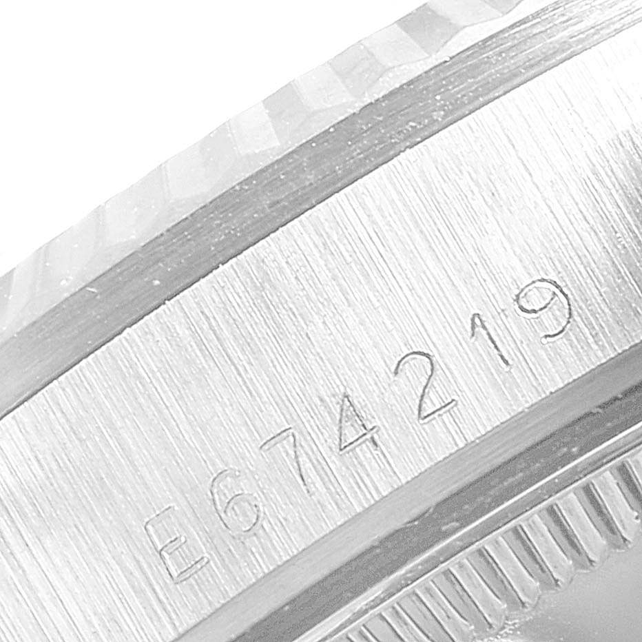 This image shows an angled close-up of the engraved serial number on the case of a Rolex President 68279 Women's White Gold Silver Dial 68279 Women's White Gold Silver Dial model watch.