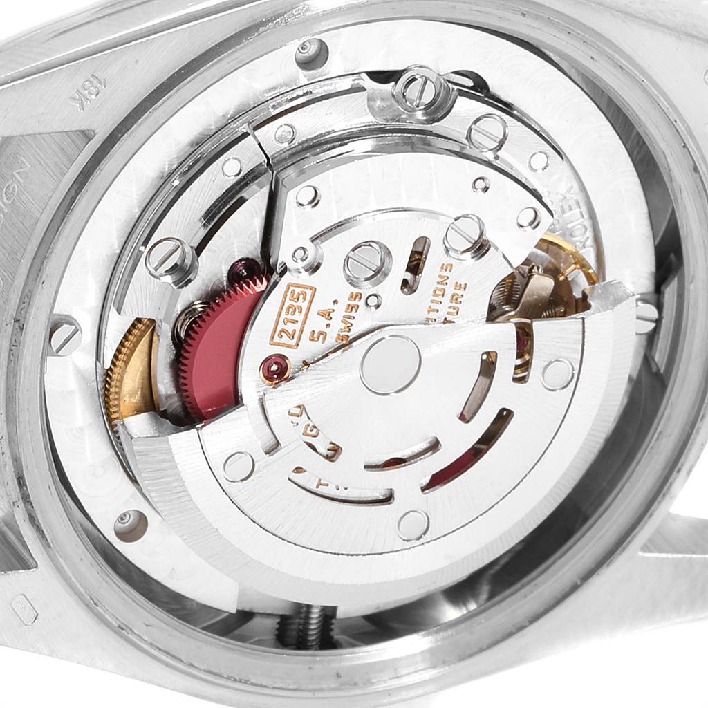 The image shows the intricate mechanical movement of a Rolex President 68279 Women's White Gold Silver Dial 68279 Women's White Gold Silver Dial model watch from the back.