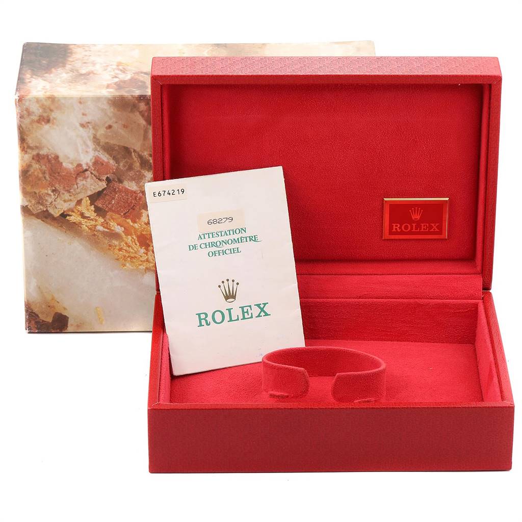 This image shows a red Rolex President 68279 Women's White Gold Silver Dial 68279 Women's White Gold Silver Dial model watch box open, displaying the certification and watch holder inside.