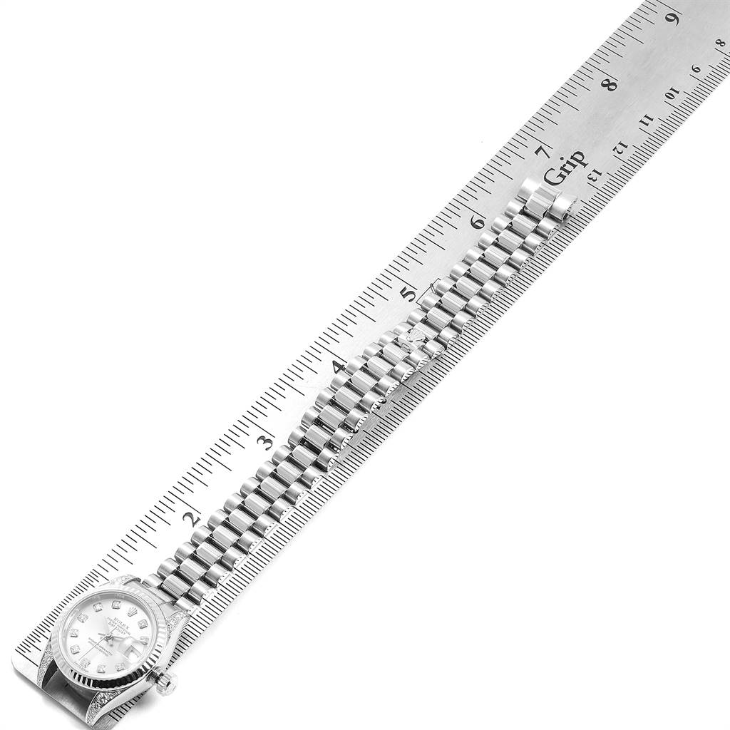 The image shows a Rolex President 179239 Women's White Gold Silver Dial 179239 Women's White Gold Silver Dial model watch lying flat with a bracelet, next to a ruler for measurement.