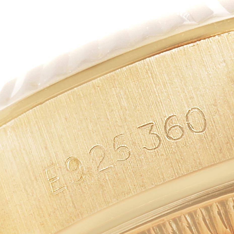 This close-up image shows the engraved serial number on the side of the Rolex President 69178 Women's Yellow Gold Silver Dial 69178 Women's Yellow Gold Silver Dial model watch case.