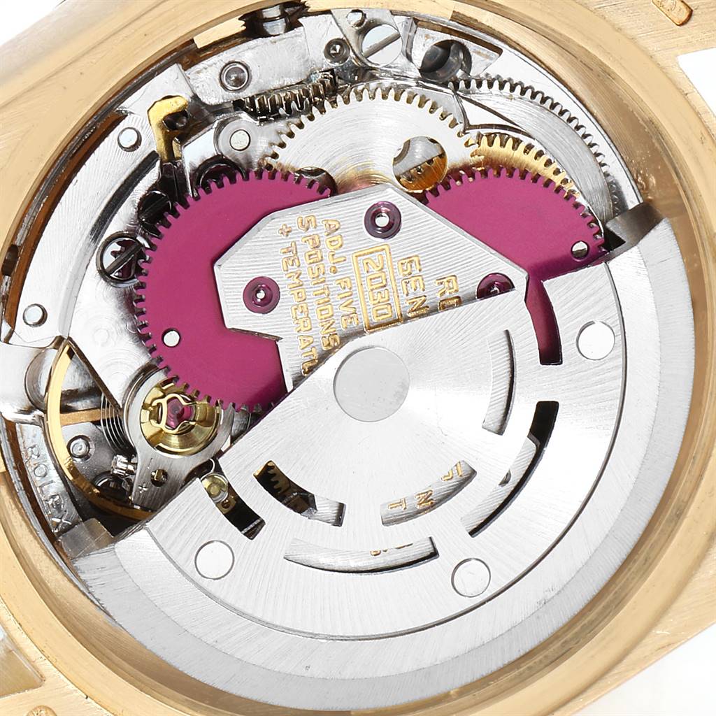 The image shows the internal mechanism and components of a Rolex President 6917 Women
s Yellow Gold Champagne Dial 6917 Women
s Yellow Gold Champagne Dial model watch from a close-up angle.