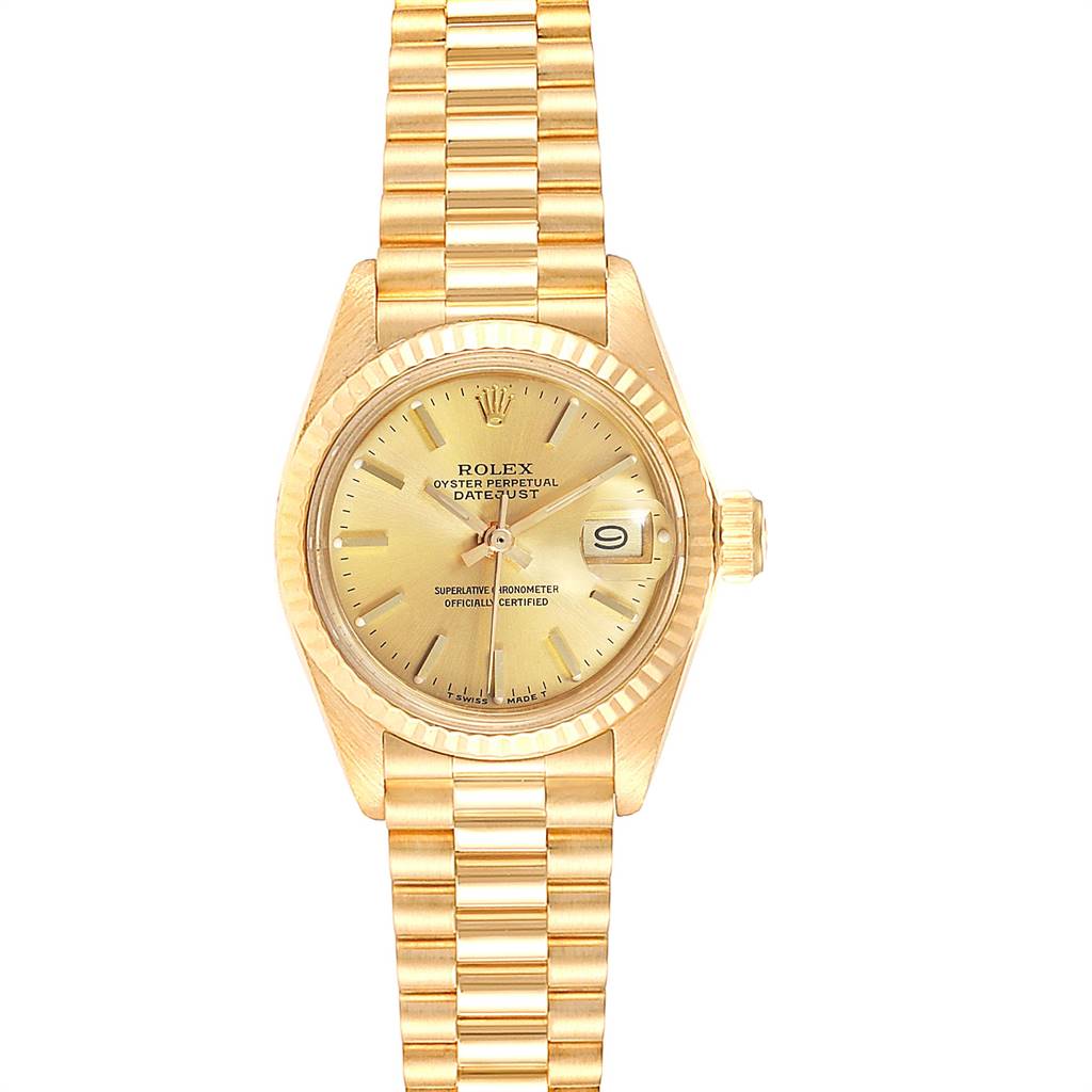 The image shows a front view of a Rolex President 6917 Women
s Yellow Gold Champagne Dial 6917 Women
s Yellow Gold Champagne Dial model watch, featuring its golden dial, fluted bezel, and bracelet.