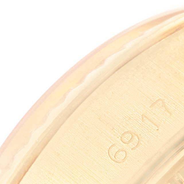 The image shows a close-up of the side of a Rolex President 6917 Women
s Yellow Gold Champagne Dial 6917 Women
s Yellow Gold Champagne Dial watch, focusing on the engraved model number.