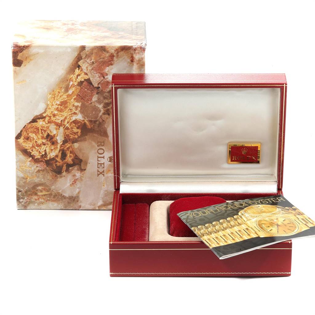 The image shows a Rolex President 69278 Women's Yellow Gold Blue Dial 69278 Women's Yellow Gold Blue Dial model watch box and accessories, including a manual and display cushion, viewed from the front.