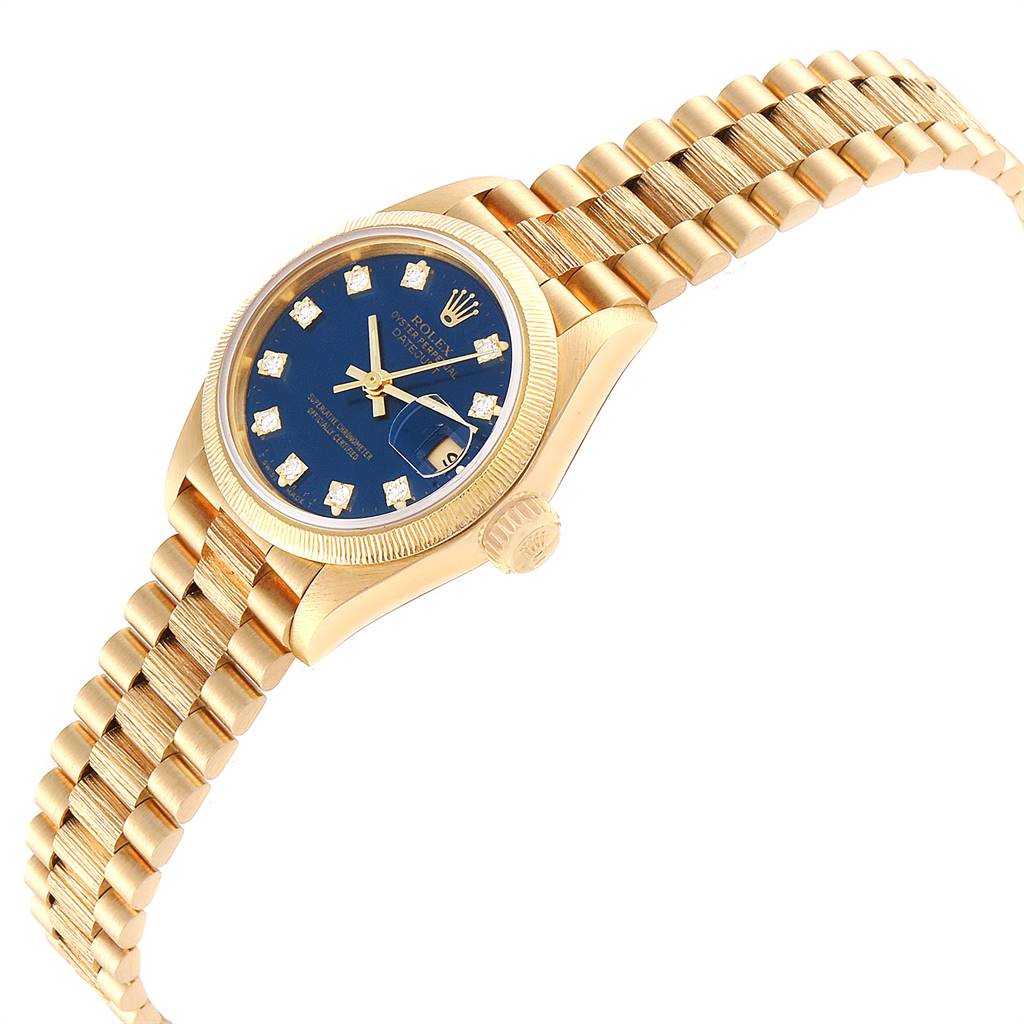 The Rolex President 69278 Women's Yellow Gold Blue Dial 69278 Women's Yellow Gold Blue Dial watch is shown at an angle highlighting its blue dial, gold case, crown, and bracelet.
