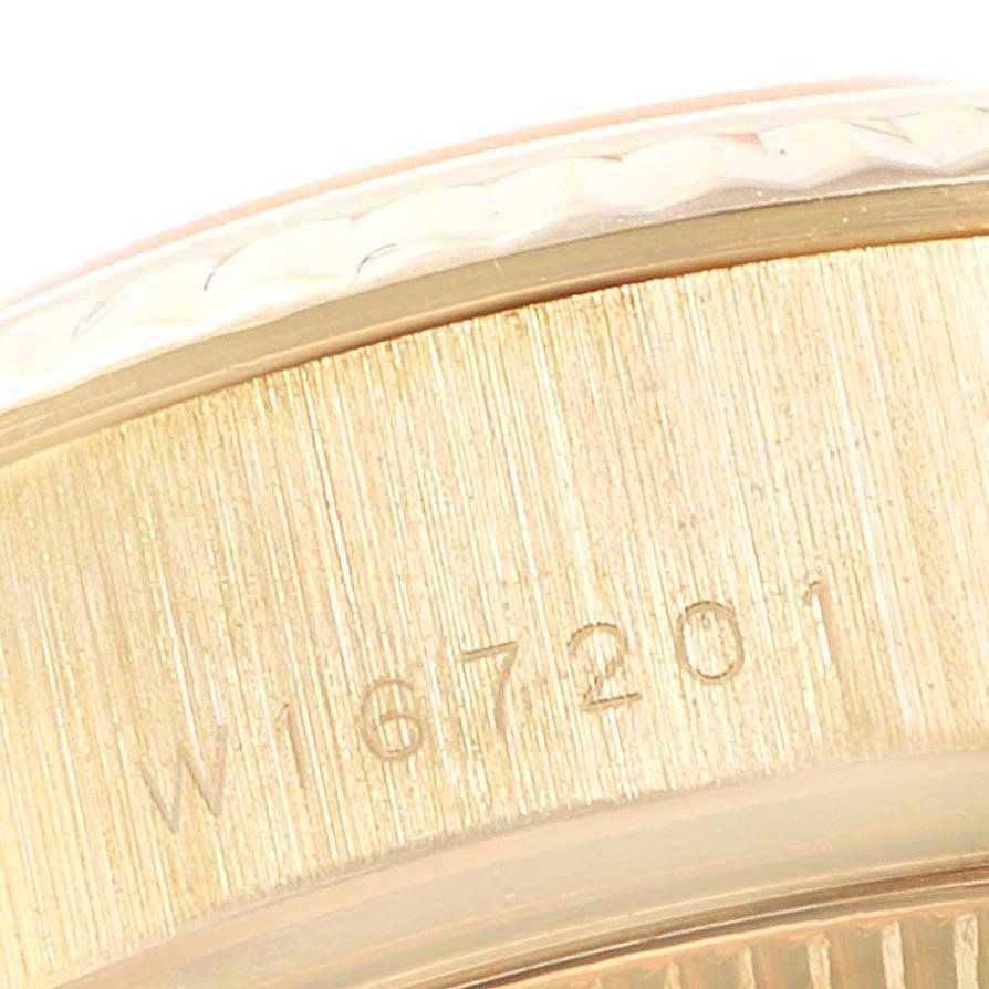 This image shows a close-up of the case side of a Rolex President 69178 Women
s Yellow Gold White Dial 69178 Women
s Yellow Gold White Dial model watch, highlighting the serial number engraved on it.