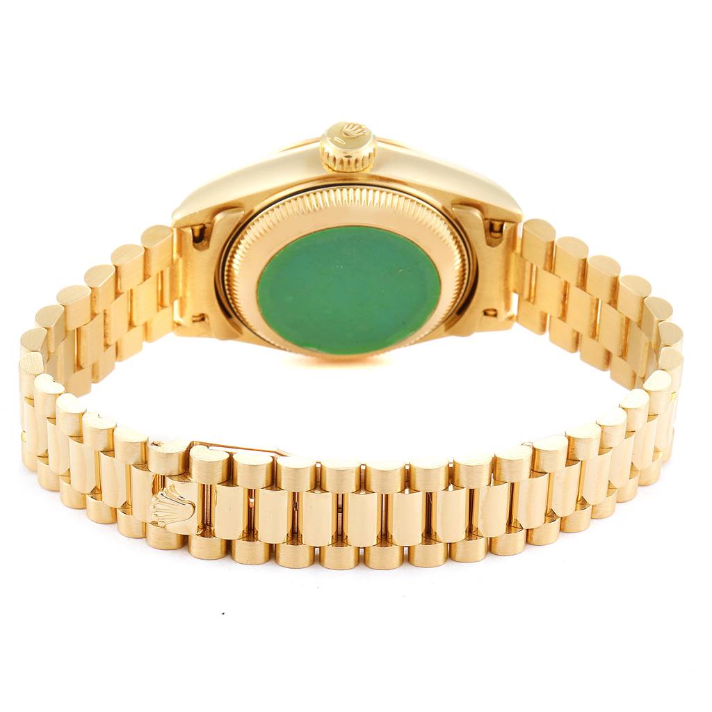 This image shows the back view of a Rolex President 69178 Women
s Yellow Gold White Dial 69178 Women
s Yellow Gold White Dial model watch, highlighting its gold bracelet and case.