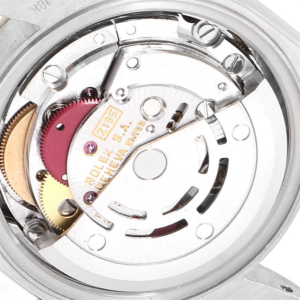 This image shows the internal mechanism of a Rolex President 69179 Women's White Gold Red Dial 69179 Women's White Gold Red Dial model watch, showcasing its intricate gears and components.