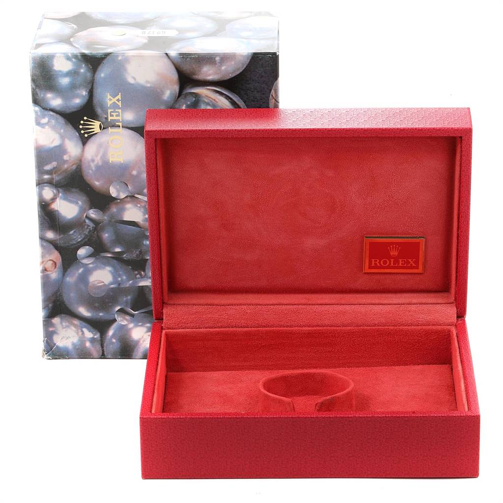 The image shows an open Rolex President 69179 Women's White Gold Red Dial 69179 Women's White Gold Red Dial model watch case with a red interior and an external box featuring a pearl-like design.